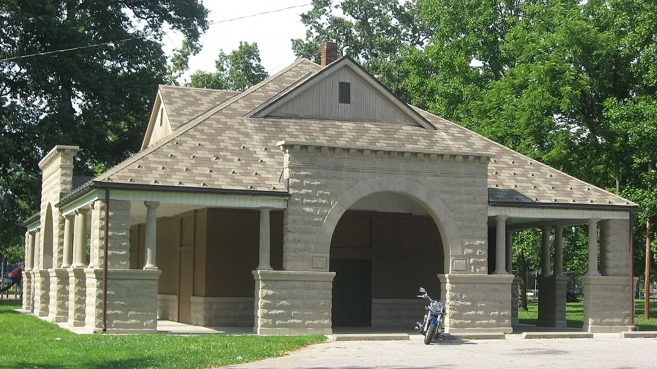 Stone arches and shaded porches of the pavilion at Collett Park