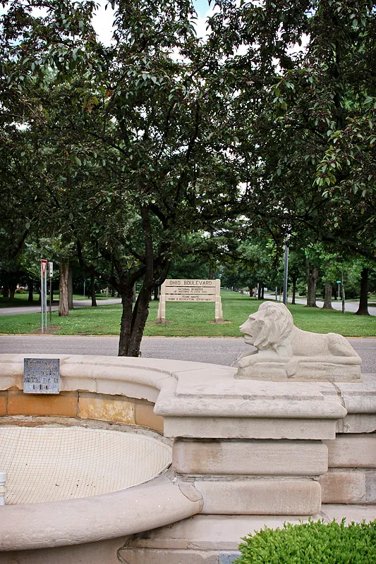 A stone lion at the historic fountain on Ohio Boulevard